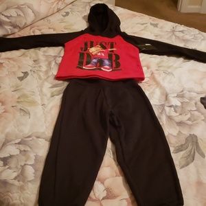 A child's jogging suit with a hood.